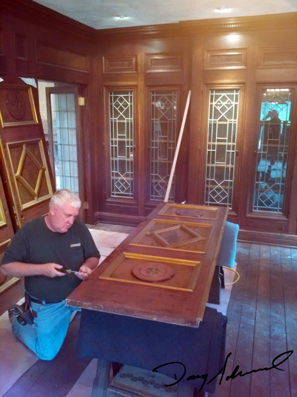 Doug Marvel at work on one of the intricate doors at the Parry Mansion